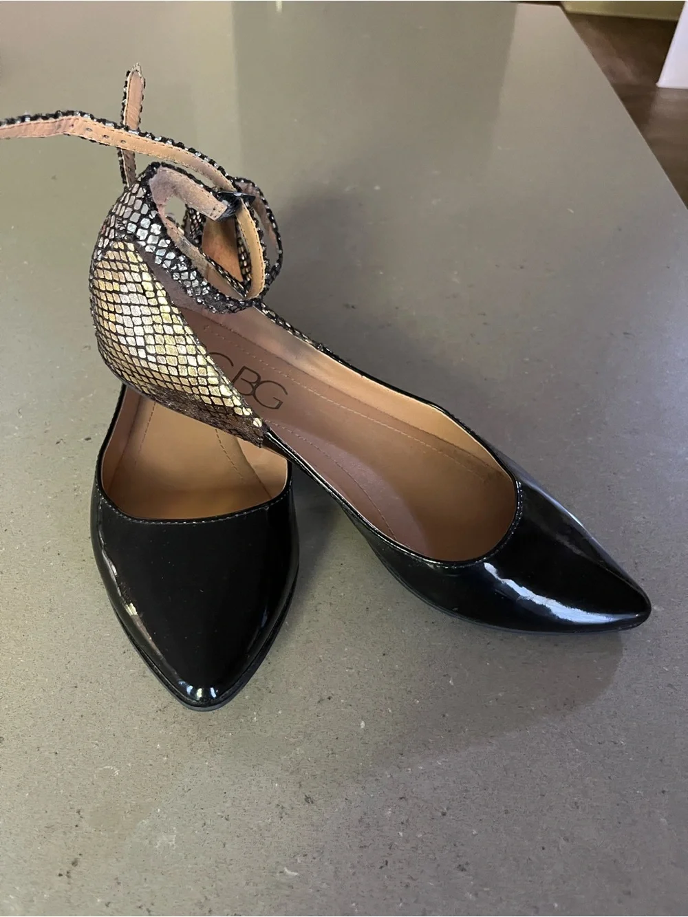BCBG Black Patent Pointed Toe Flats with Metallic Snakeskin Ankle Strap